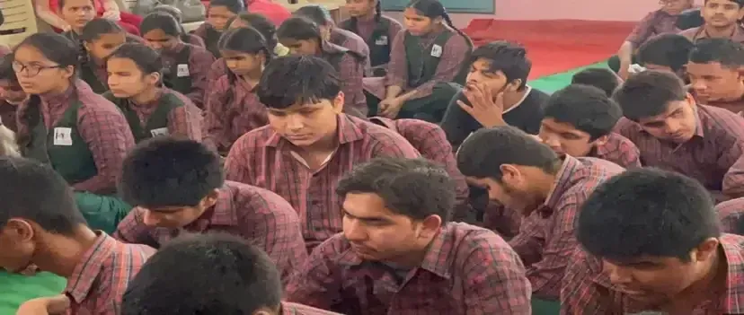 school students in a classroom studying