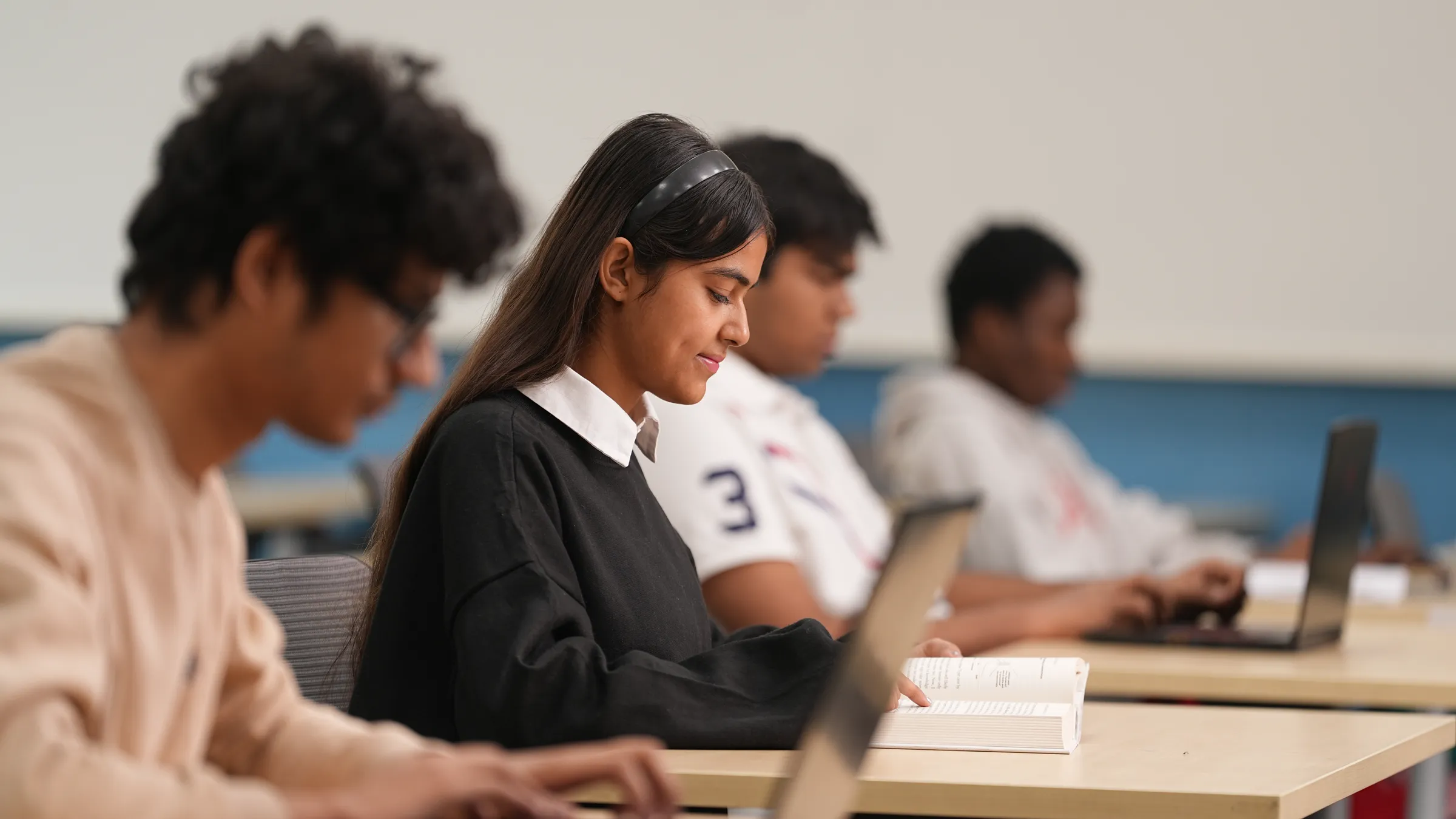 banner image of a girl studying