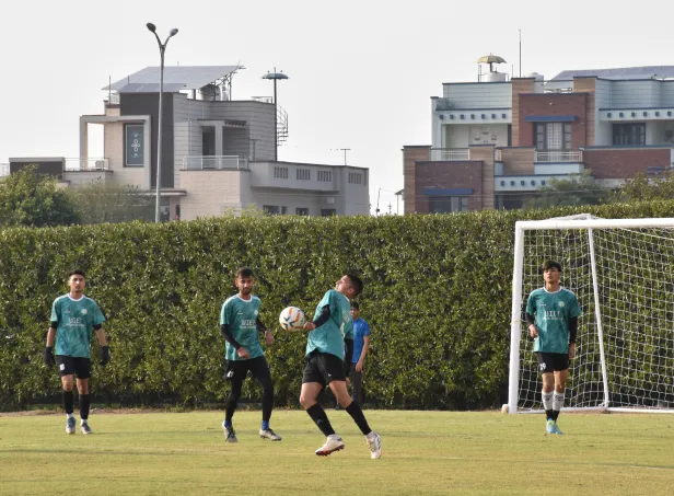 Students playing a team sport on campus.